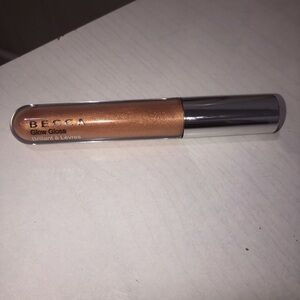 BECCA Glow Gloss in the shade “Champagne Crème”